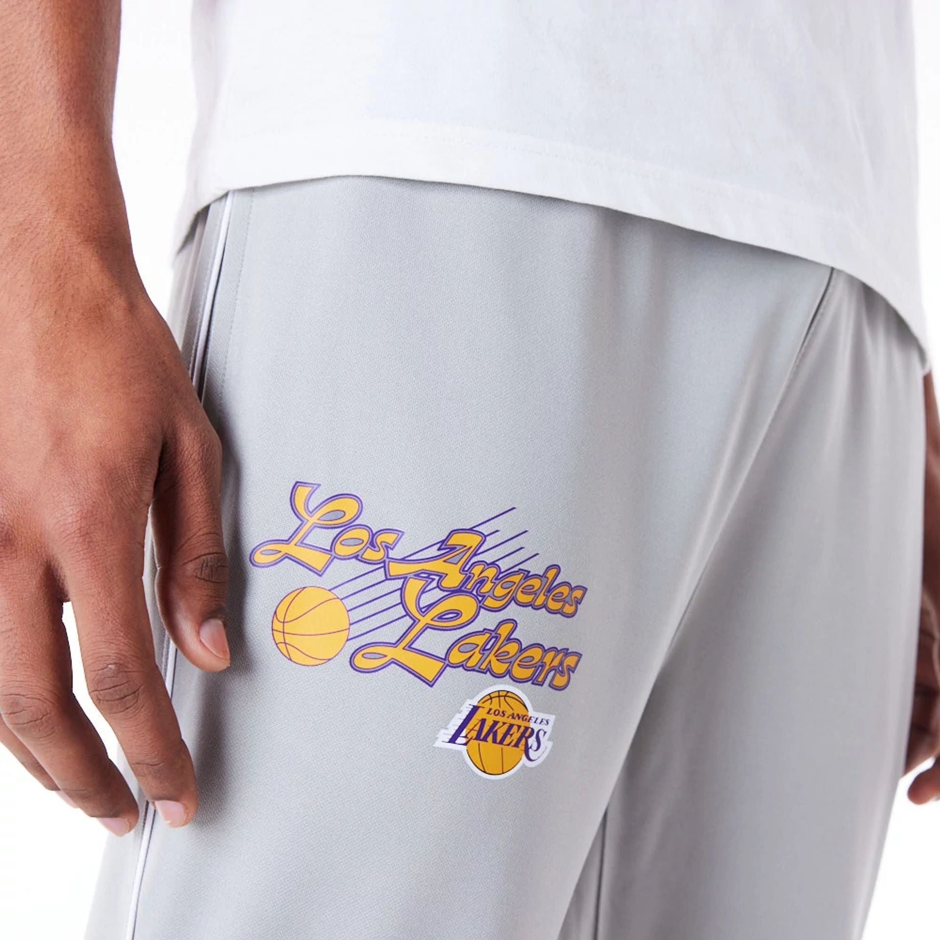 The Male model is wearing LA Lakers NBA Script Grey Fleece Track Joggers 2