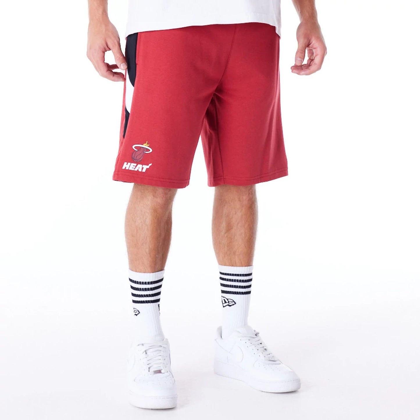 The Male model is wearing Miami Heat NBA Panel Dark Red Oversized Shorts 1