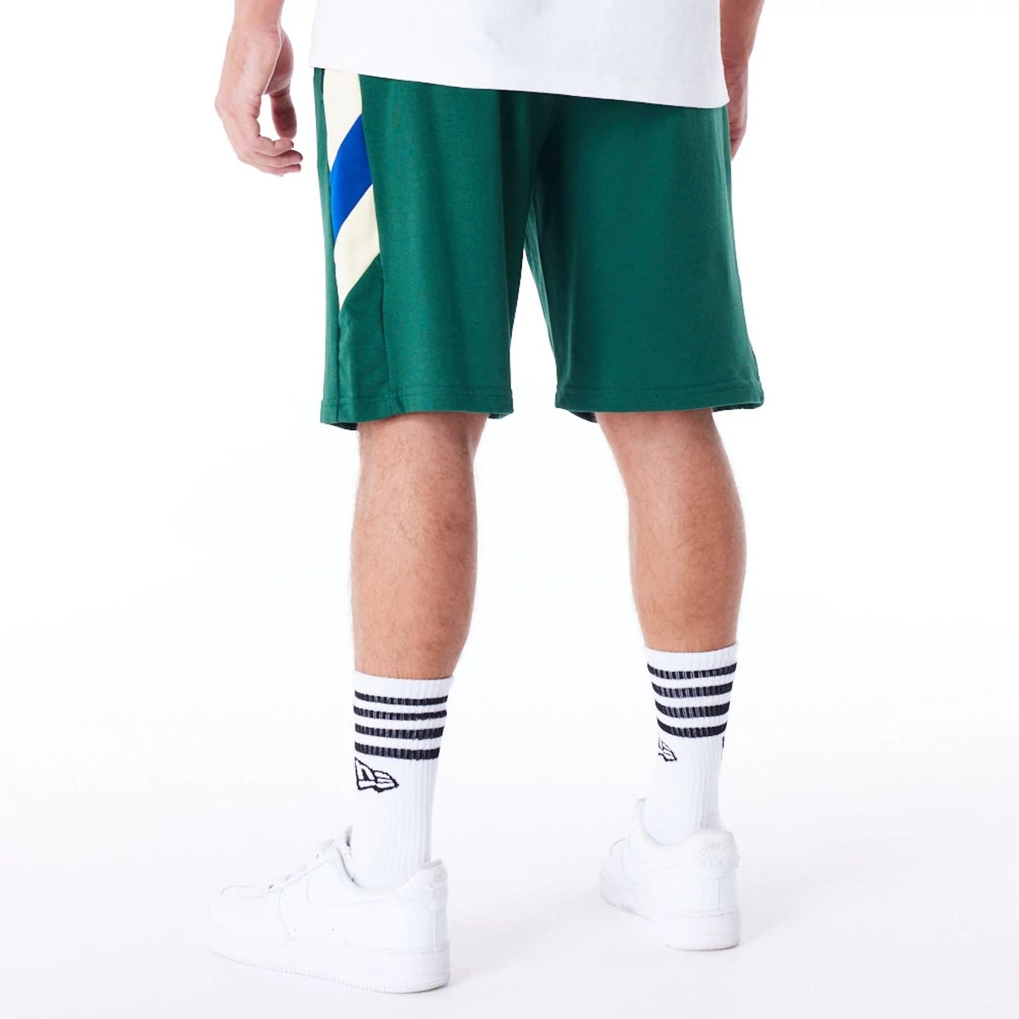 The Male model is wearing Milwaukee Bucks NBA Panel Dark Green Oversized Shorts 7