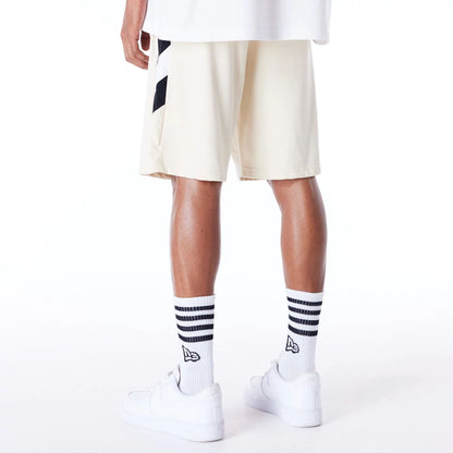 The Male model is wearing Boston Celtics NBA Panel Stone Oversized Shorts 2