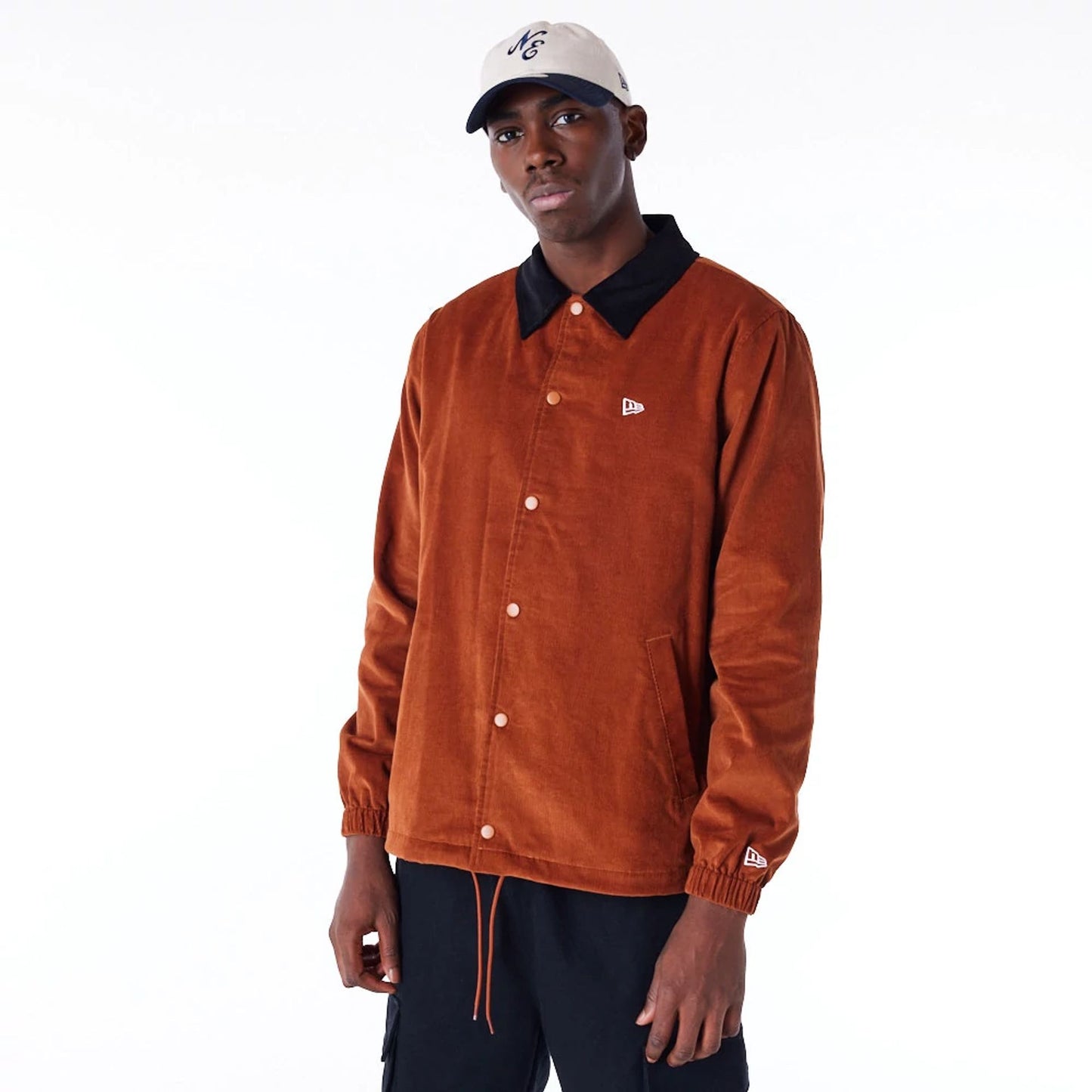 The Male model is wearing New Era Brown Cord Coach Jacket 1