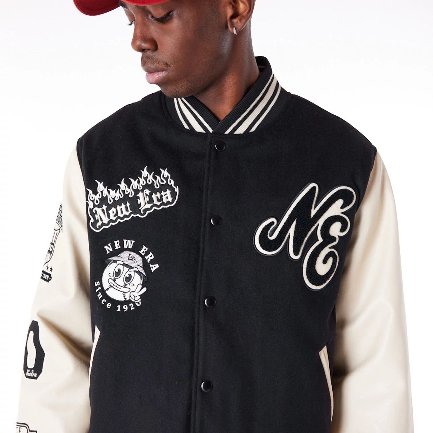 The Male model is wearing New Era Varisty Patch Black Varsity Jacket 2