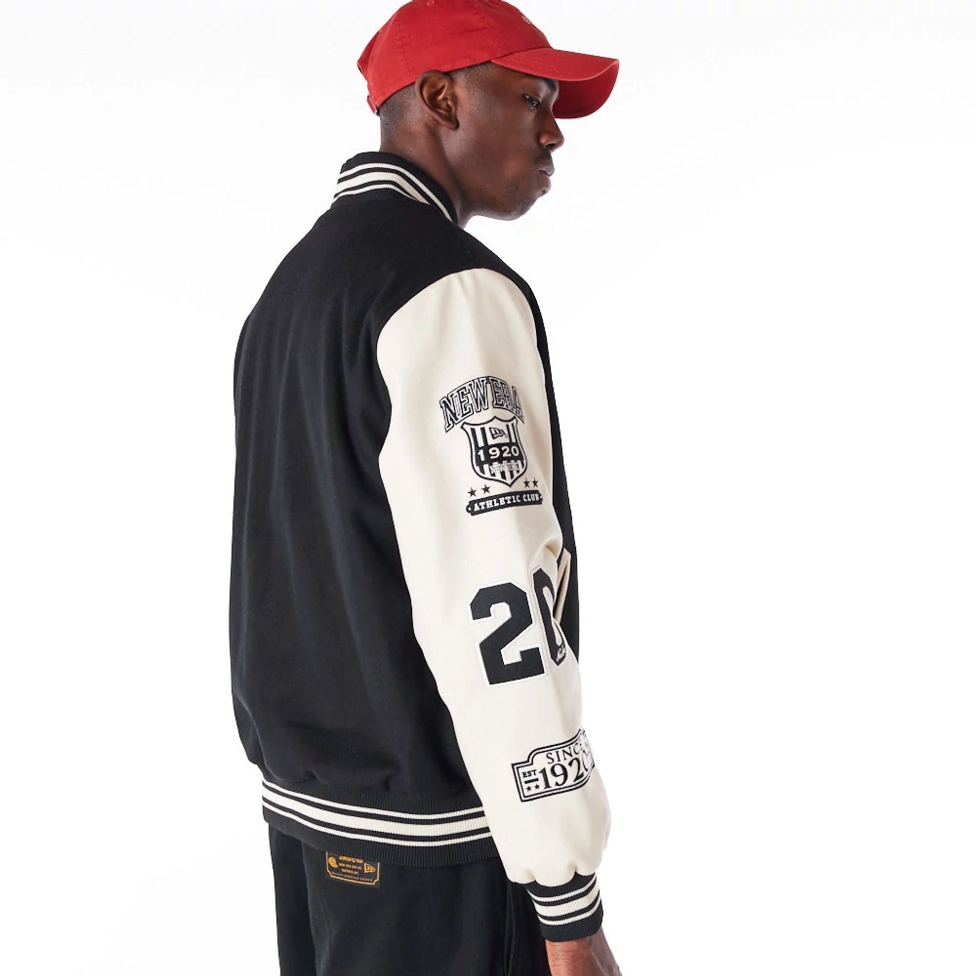 The Male model is wearing New Era Varisty Patch Black Varsity Jacket 6