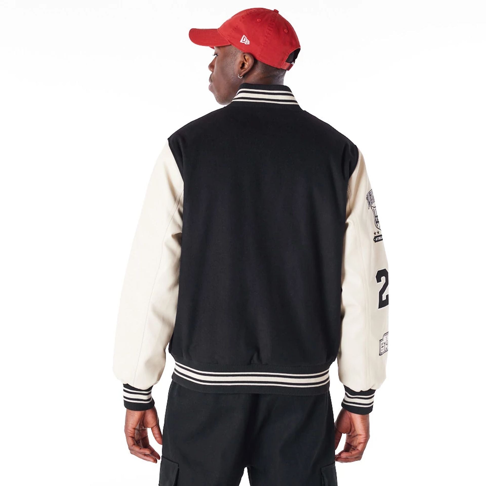 The Male model is wearing New Era Varisty Patch Black Varsity Jacket 8