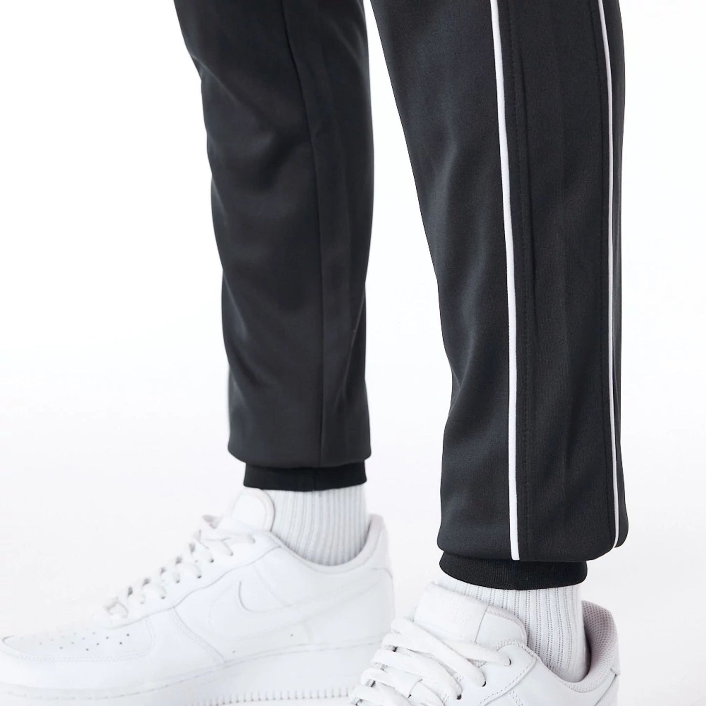 The Male model is wearing New York Yankees MLB Track Pant Black Fleece Track Joggers 3