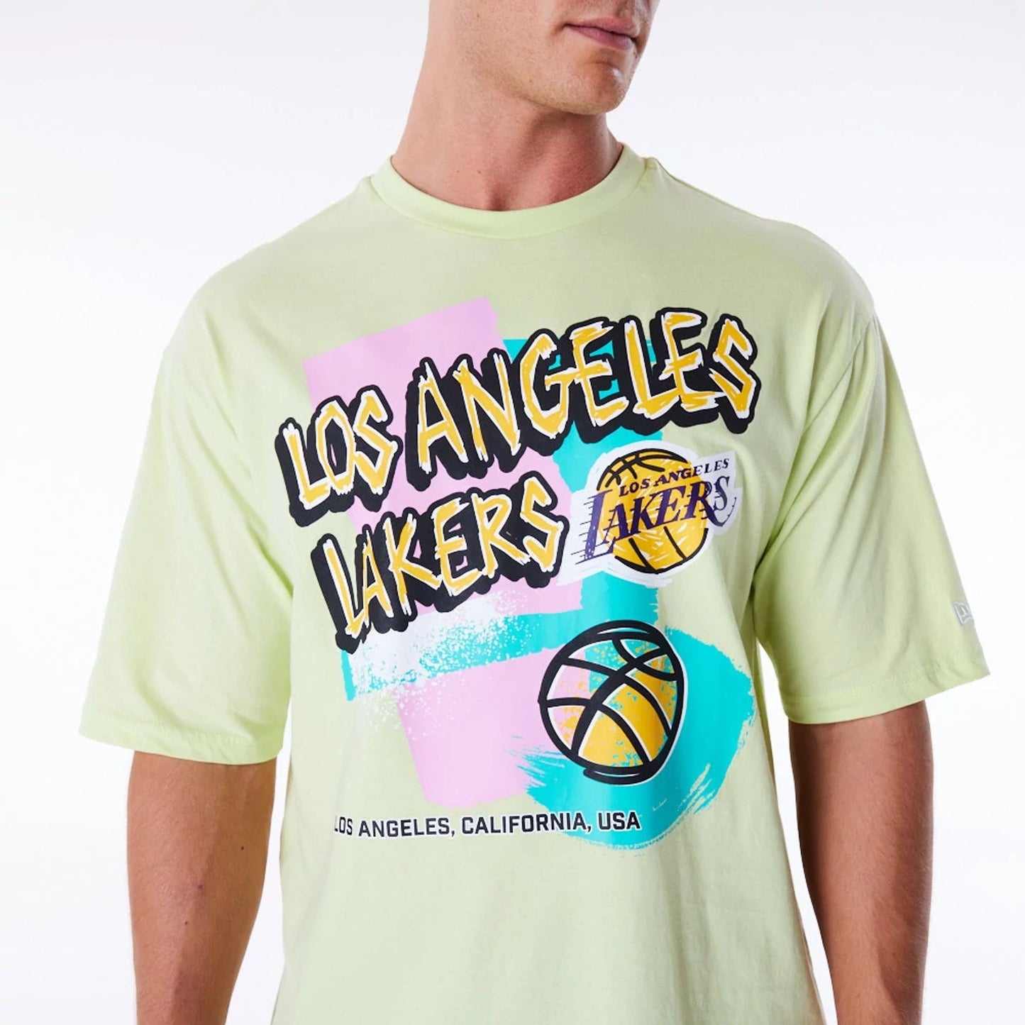 The Male model is wearing LA Lakers Retro Graphic Pastel Green Oversized T-Shirt 5