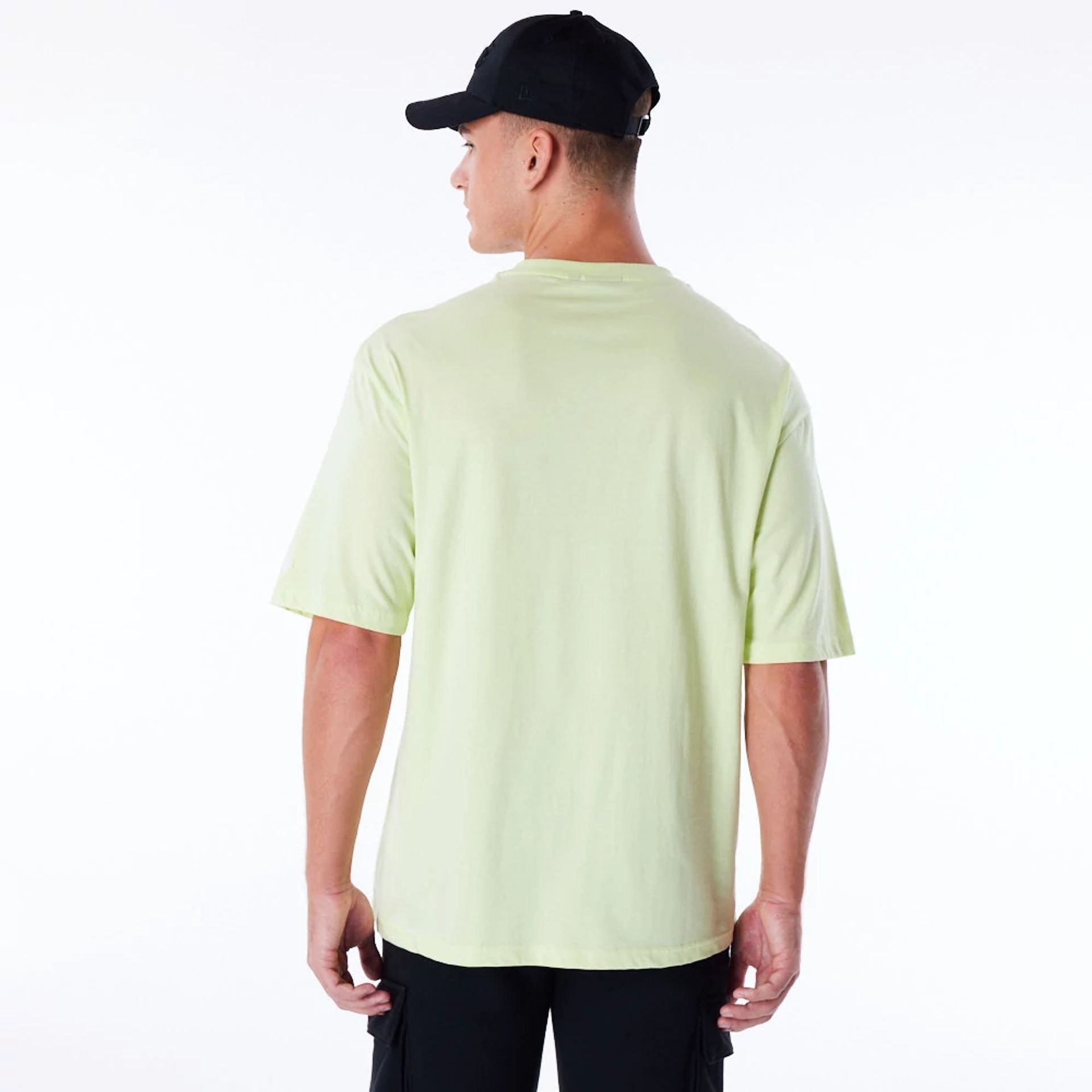 The Male model is wearing LA Lakers Retro Graphic Pastel Green Oversized T-Shirt 4