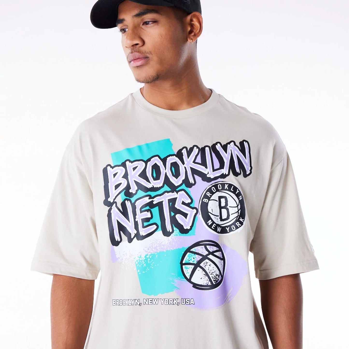 The Male model is wearing Brooklyn Nets Retro Graphic Stone Oversized T-Shirt 6