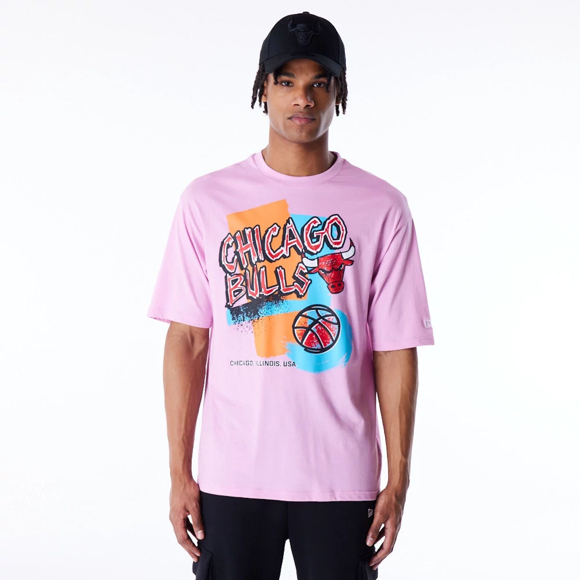 The Male model is wearing Chicago Bulls Retro Graphic Pastel Pink Oversized T-Shirt 1