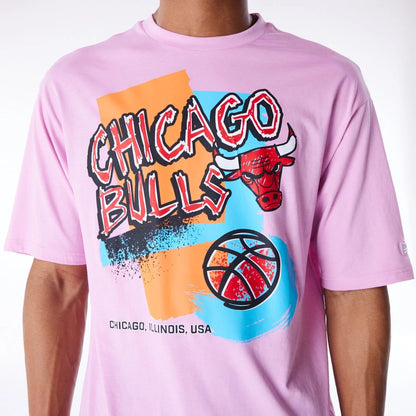 The Male model is wearing Chicago Bulls Retro Graphic Pastel Pink Oversized T-Shirt 4