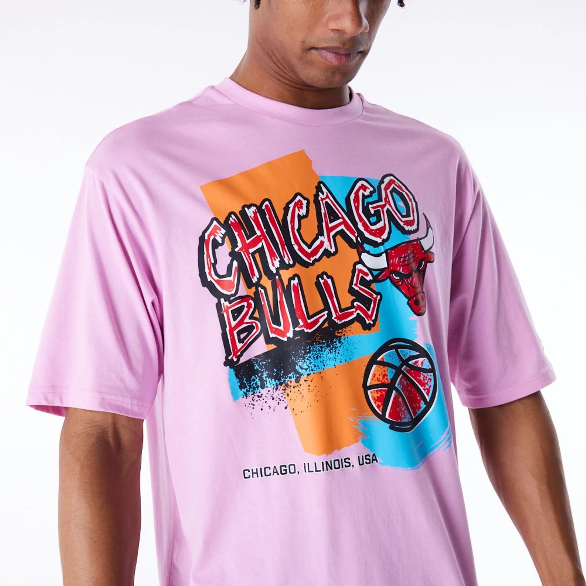 The Male model is wearing Chicago Bulls Retro Graphic Pastel Pink Oversized T-Shirt 6