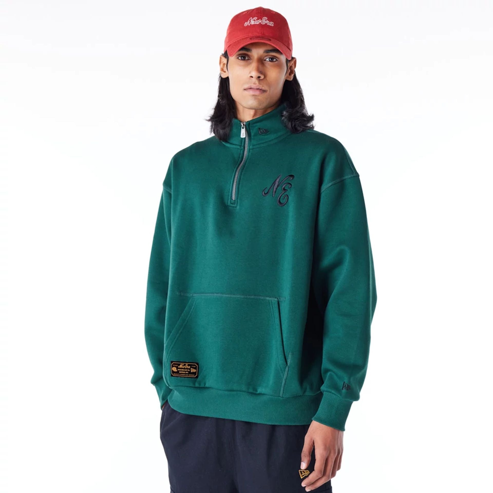 The Male model is wearing New Era Lifestyle Dark Green Quarter-Zip Sweater 2