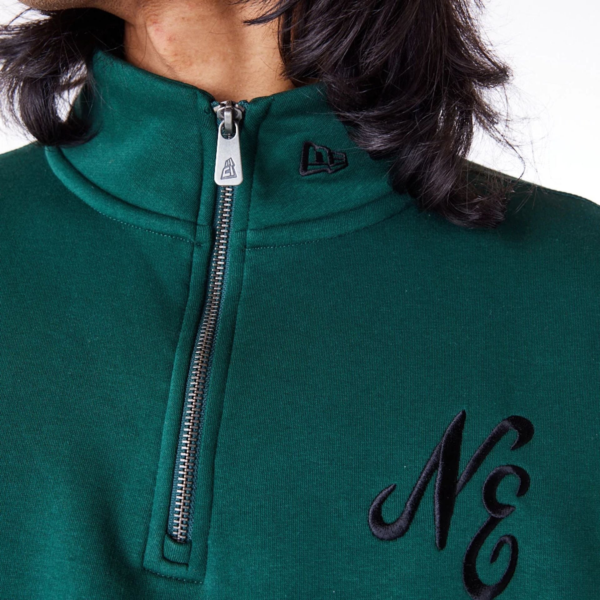 The Male model is wearing New Era Lifestyle Dark Green Quarter-Zip Sweater 7