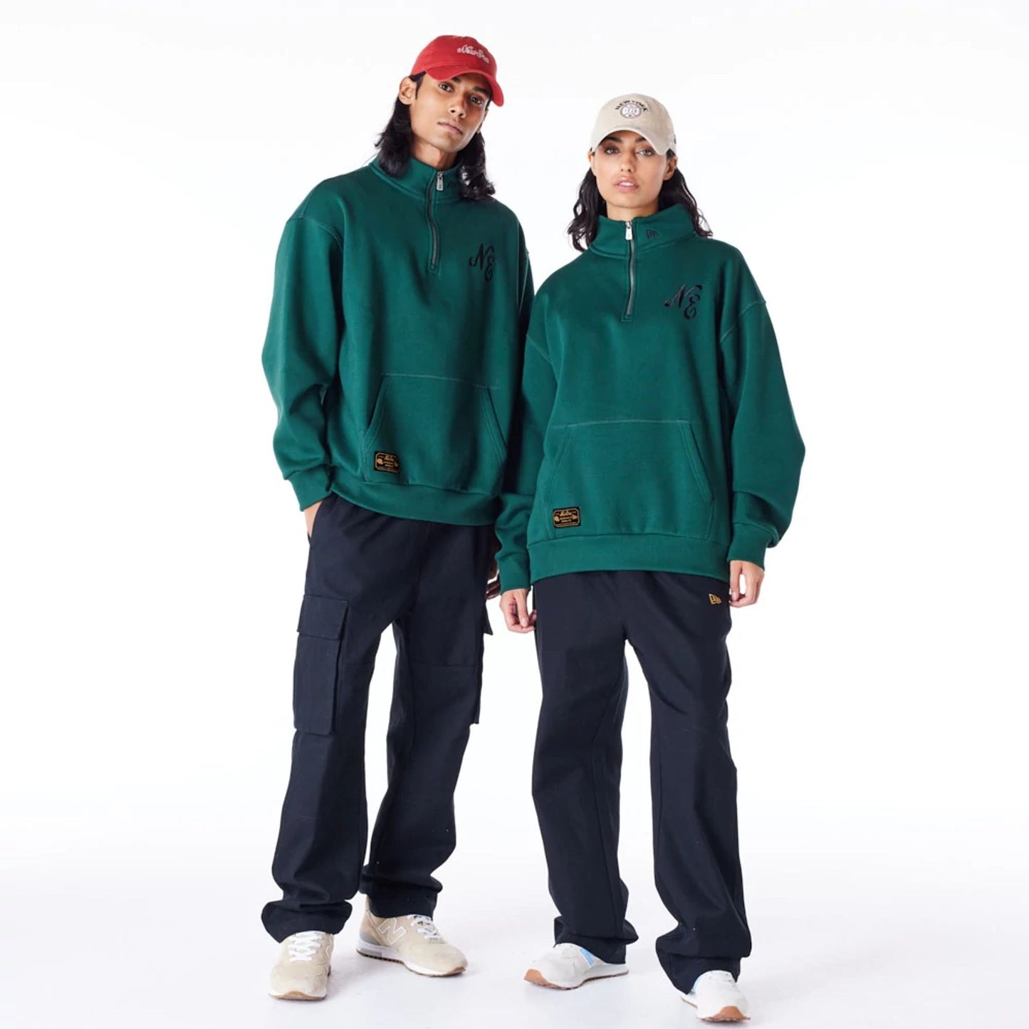 The Male model is wearing New Era Lifestyle Dark Green Quarter-Zip Sweater 10