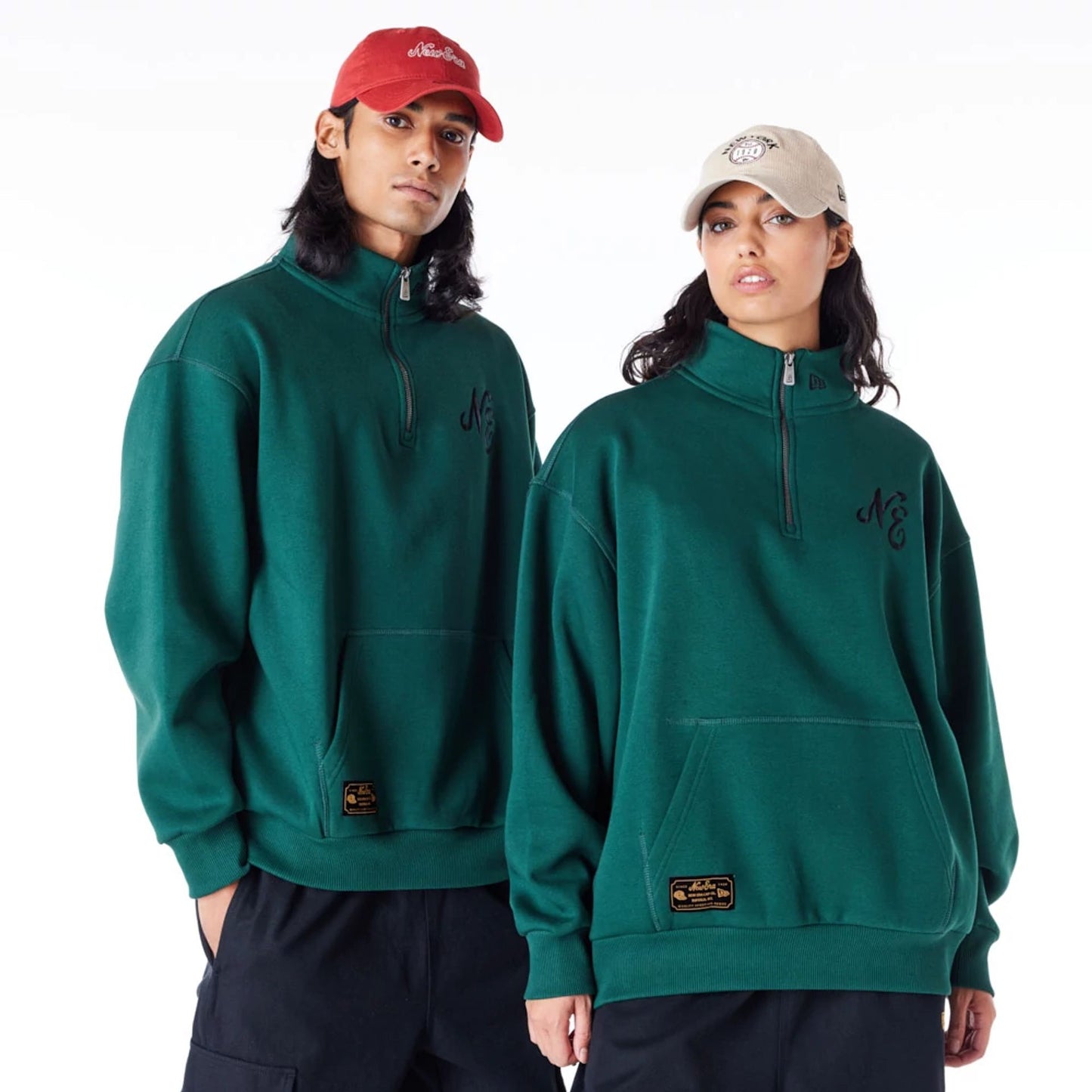 The Male model is wearing New Era Lifestyle Dark Green Quarter-Zip Sweater 1