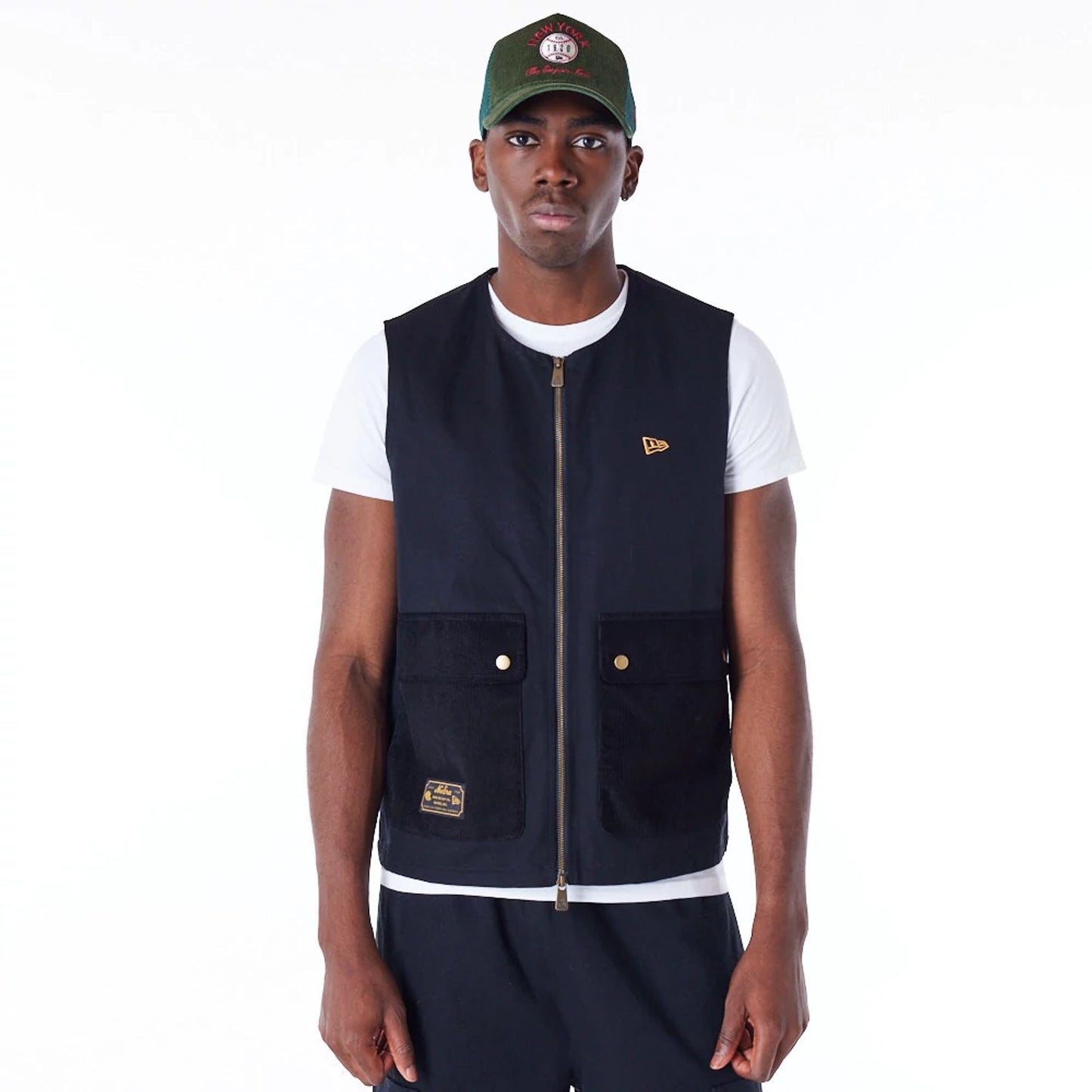 The Male model is wearing New Era Black Utility Vest Top 1