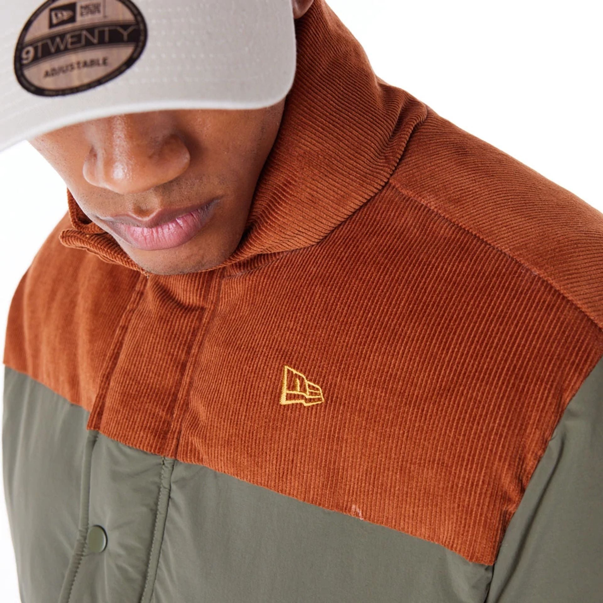 The Male model is wearing New Era Green Canvas Puffer Jacket 5