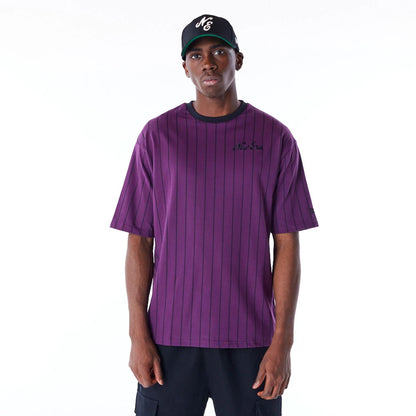 The Male model is wearing New Era Pinstripe Dark Purple Oversized T-Shirt 1