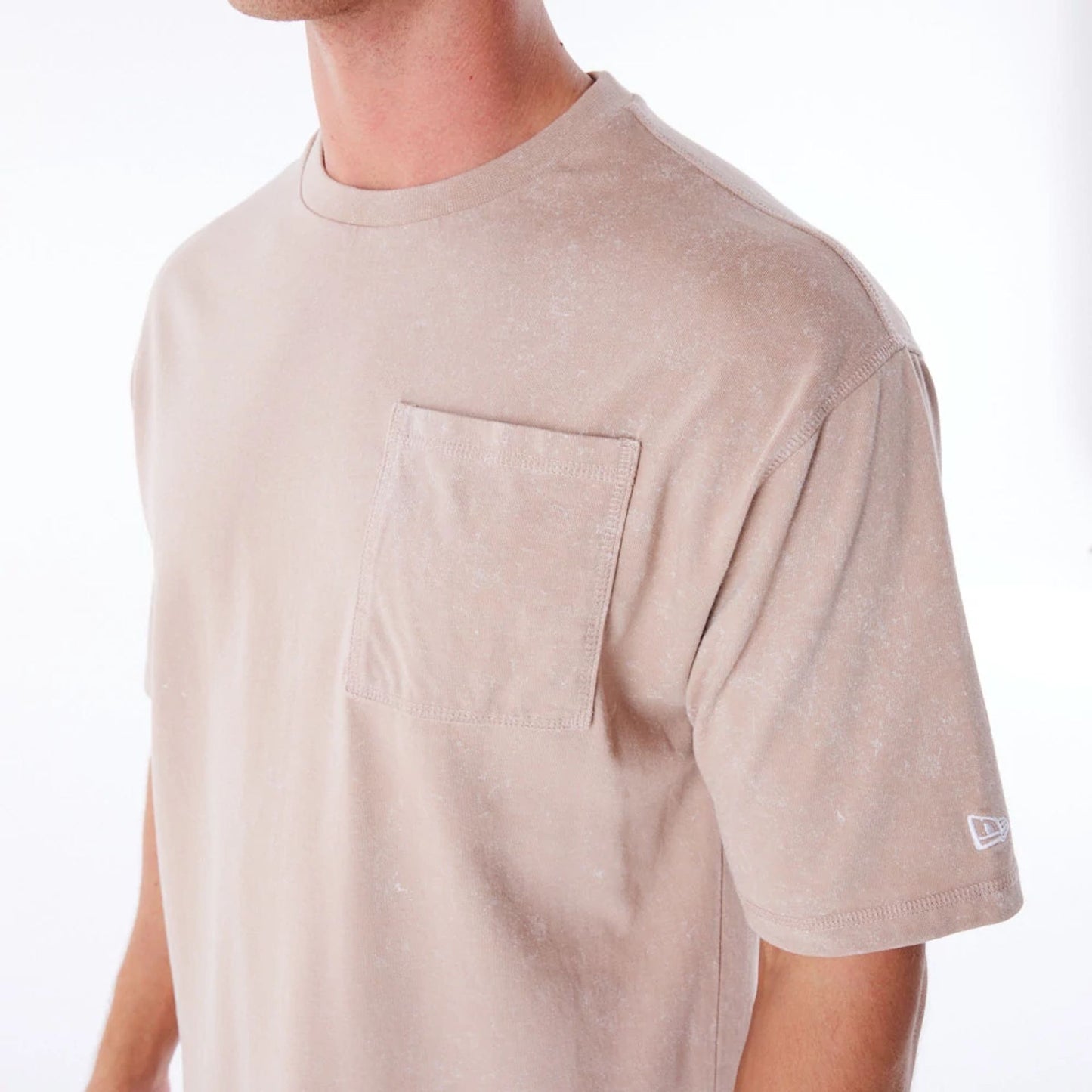 The Male model is wearing New Era Wash Beige Oversized T-Shirt 2