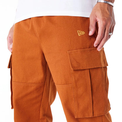 The Male model is wearing New Era Brown Cargo Trousers  7