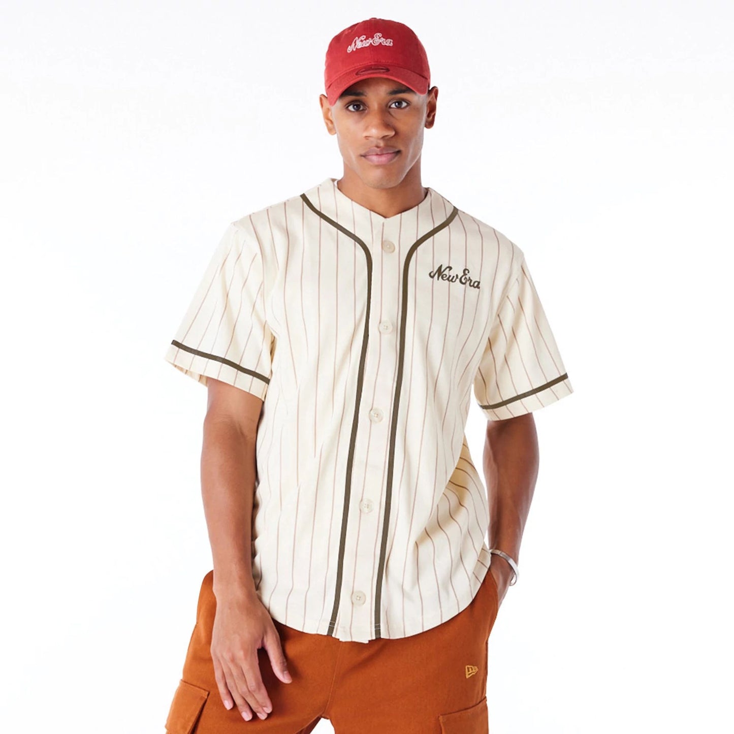 The Male model is wearing New Era Pinstripe Light Beige T-Shirt 2