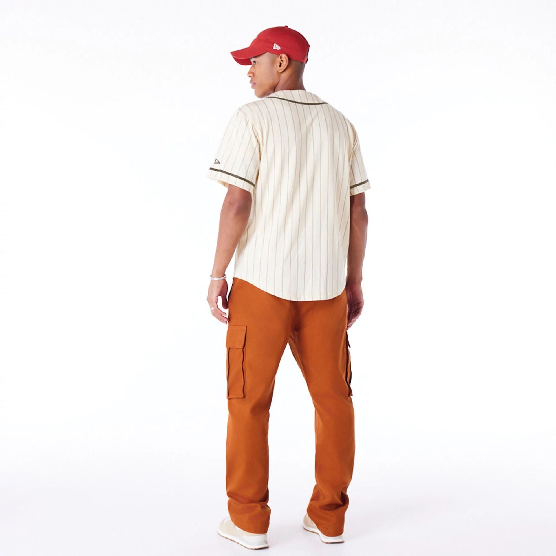 The Male model is wearing New Era Pinstripe Light Beige T-Shirt 7