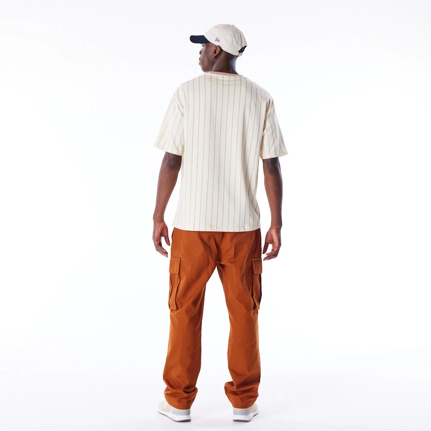 The Male model is wearing New Era Pinstripe Stone Oversized T-Shirt 7