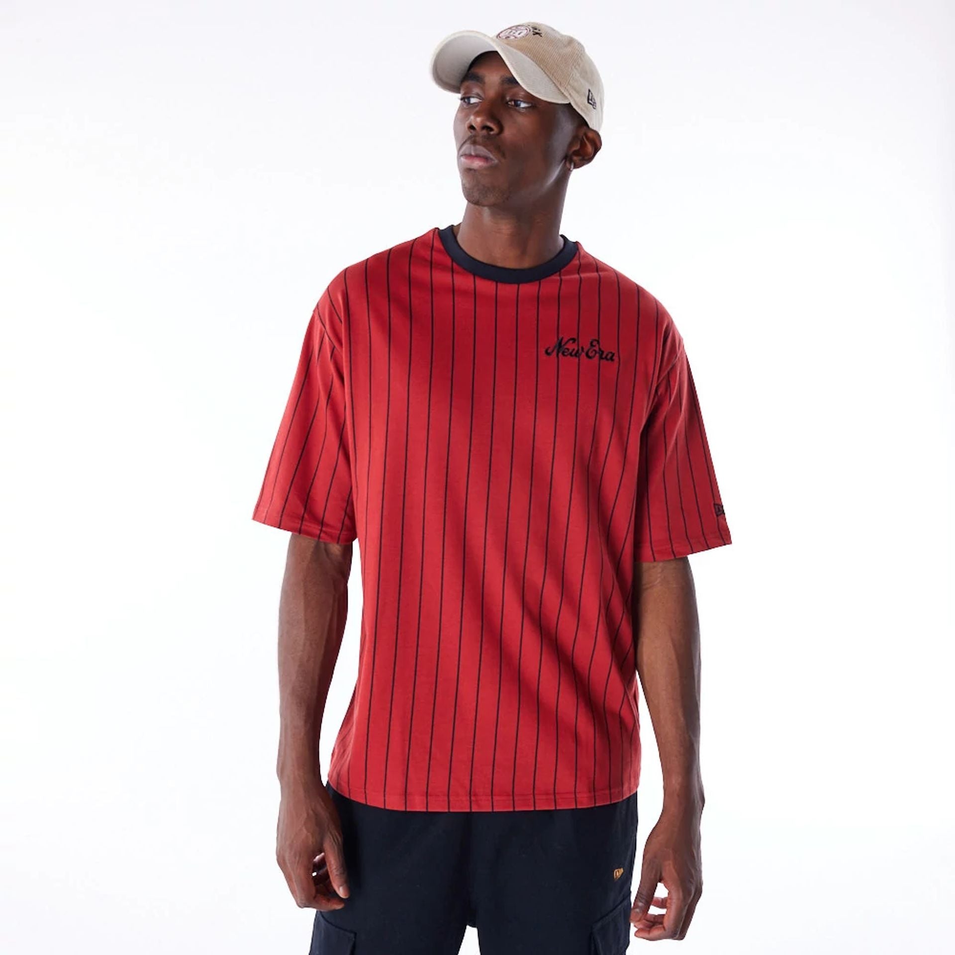 The Male model is wearing New Era Pinstripe Red Oversized T-Shirt 1