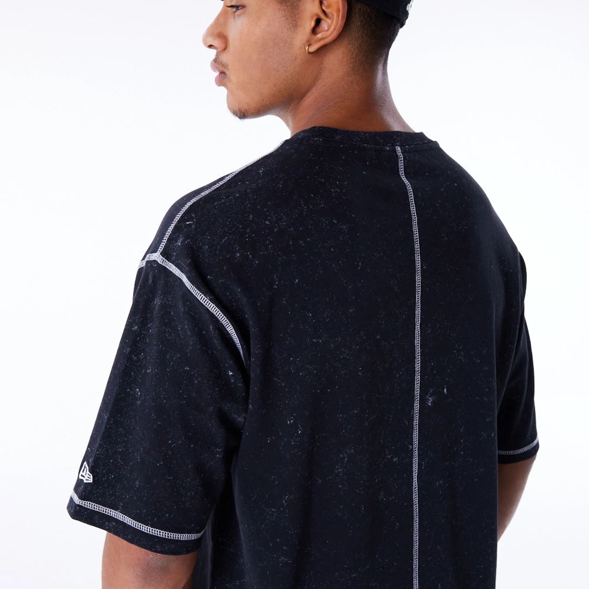 The Male model is wearing New Era Wash Black Oversized T-Shirt 6