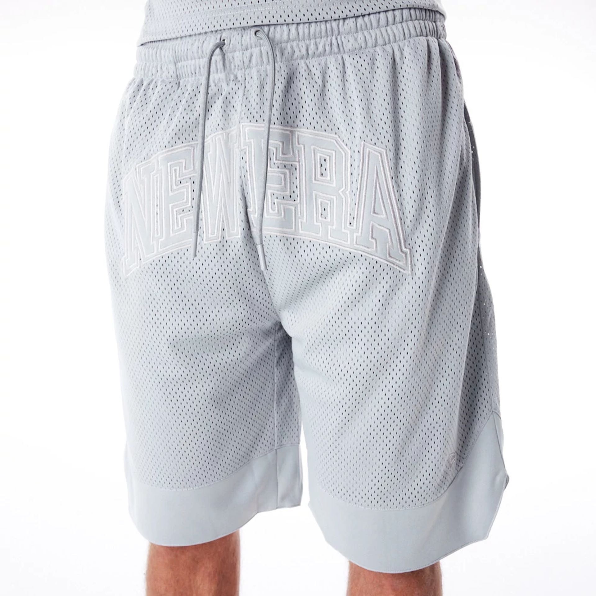 The Male model is wearing New Era Mesh Grey Oversized Shorts 2