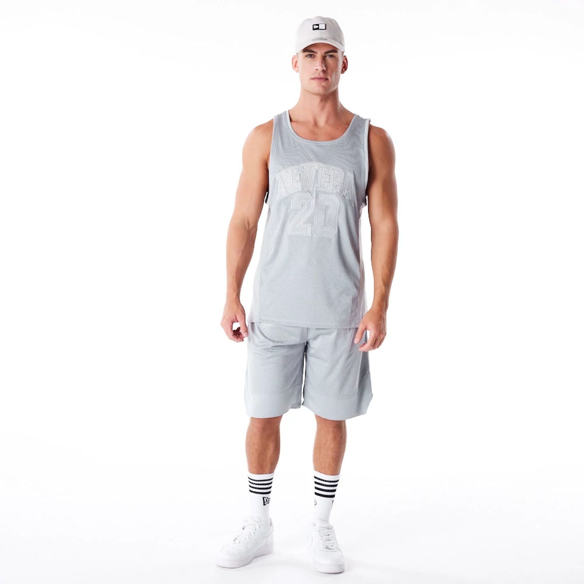 The Male model is wearing New Era Mesh Grey Oversized Shorts 7