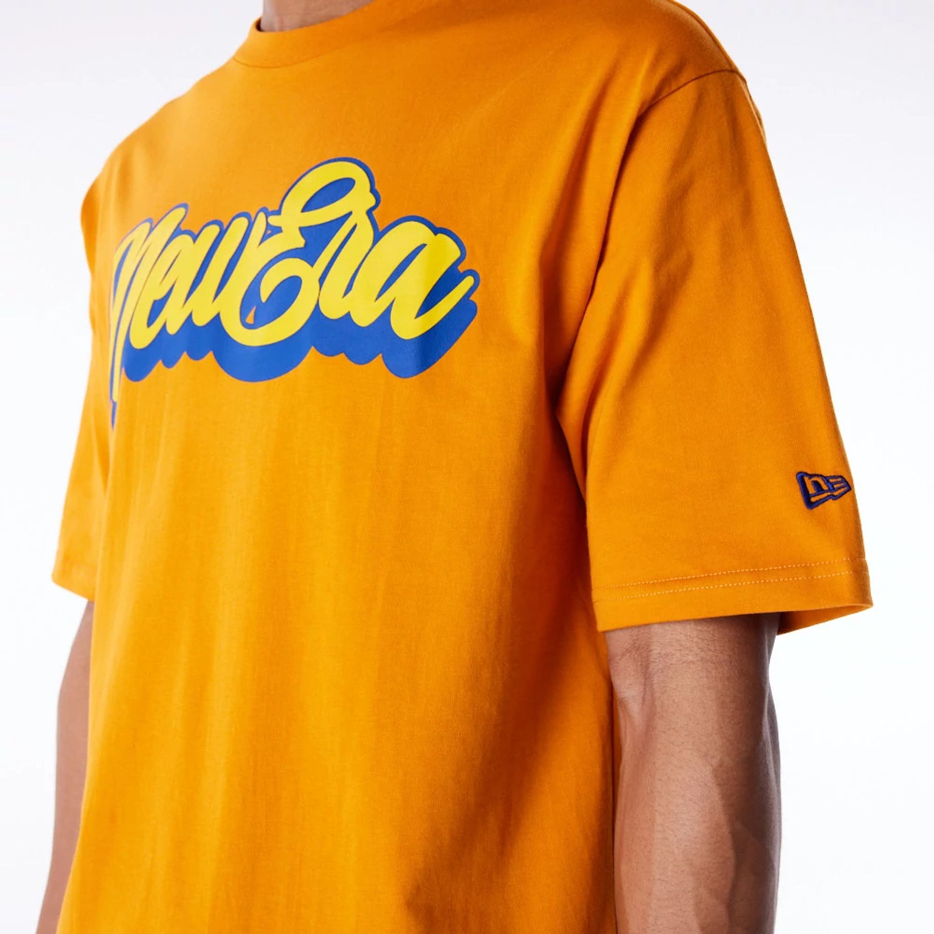 The Male model is wearing New Era Font Graphic Orange Oversized T-Shirt 4