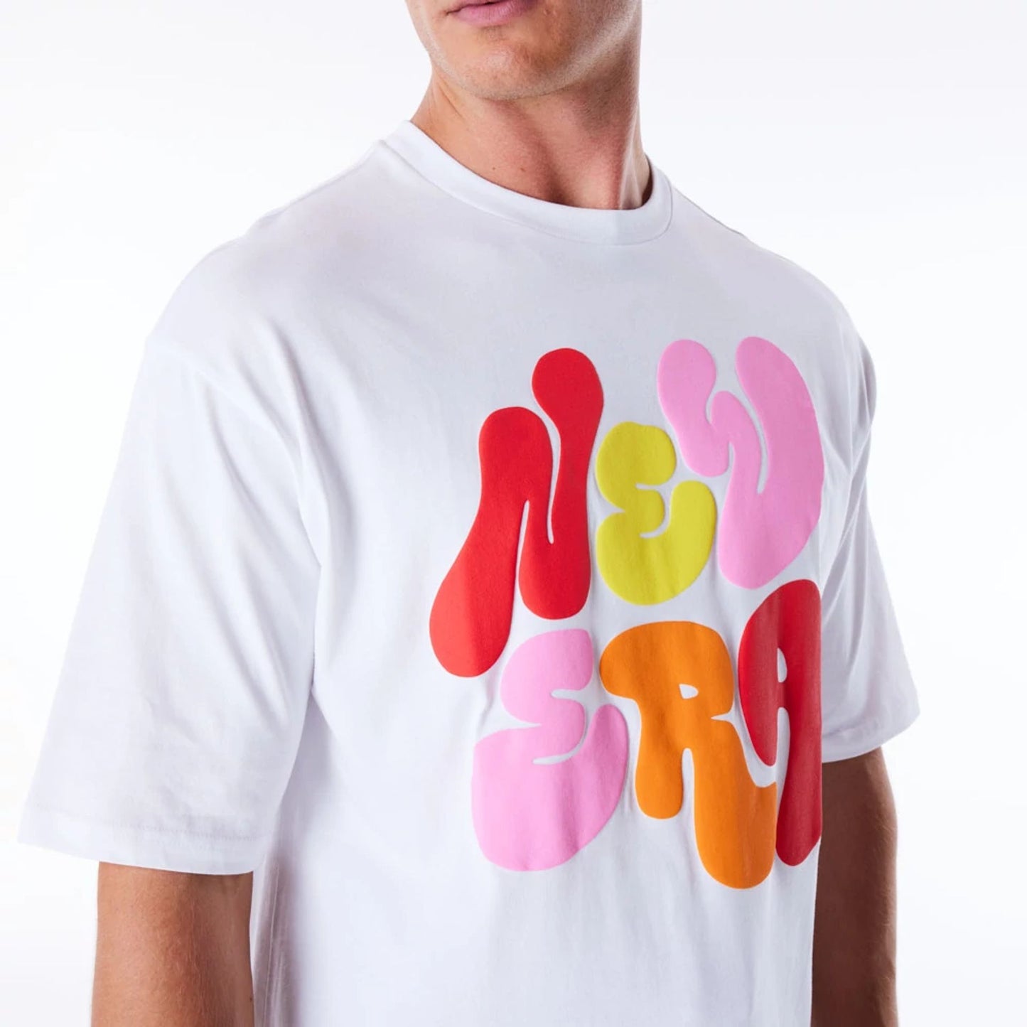 The Male model is wearing New Era Font Graphic White Oversized T-Shirt 5