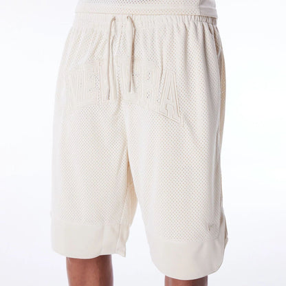 The Male model is wearing New Era Mesh Stone Oversized Shorts 2