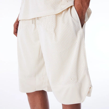 The Male model is wearing New Era Mesh Stone Oversized Shorts 5