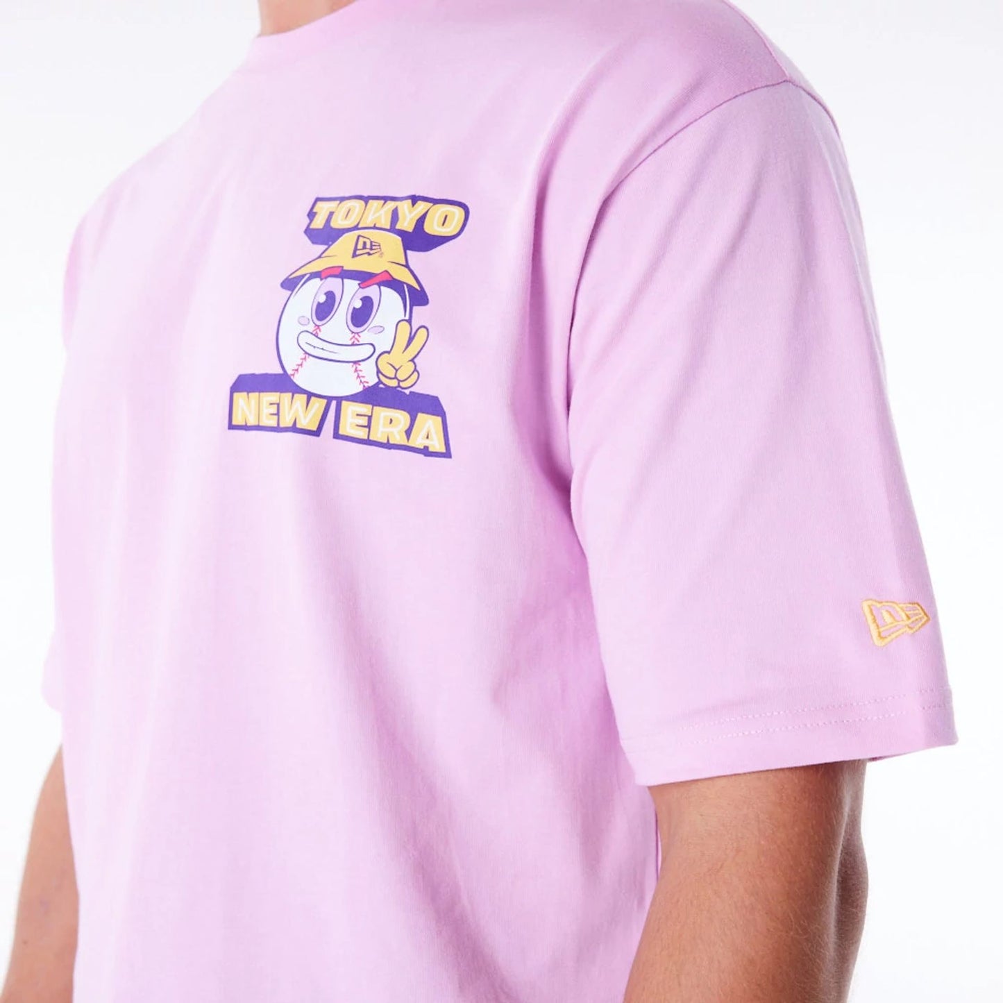 The Male model is wearing New Era Location Graphic Tokyo Pastel Pink Oversized T-Shirt 3