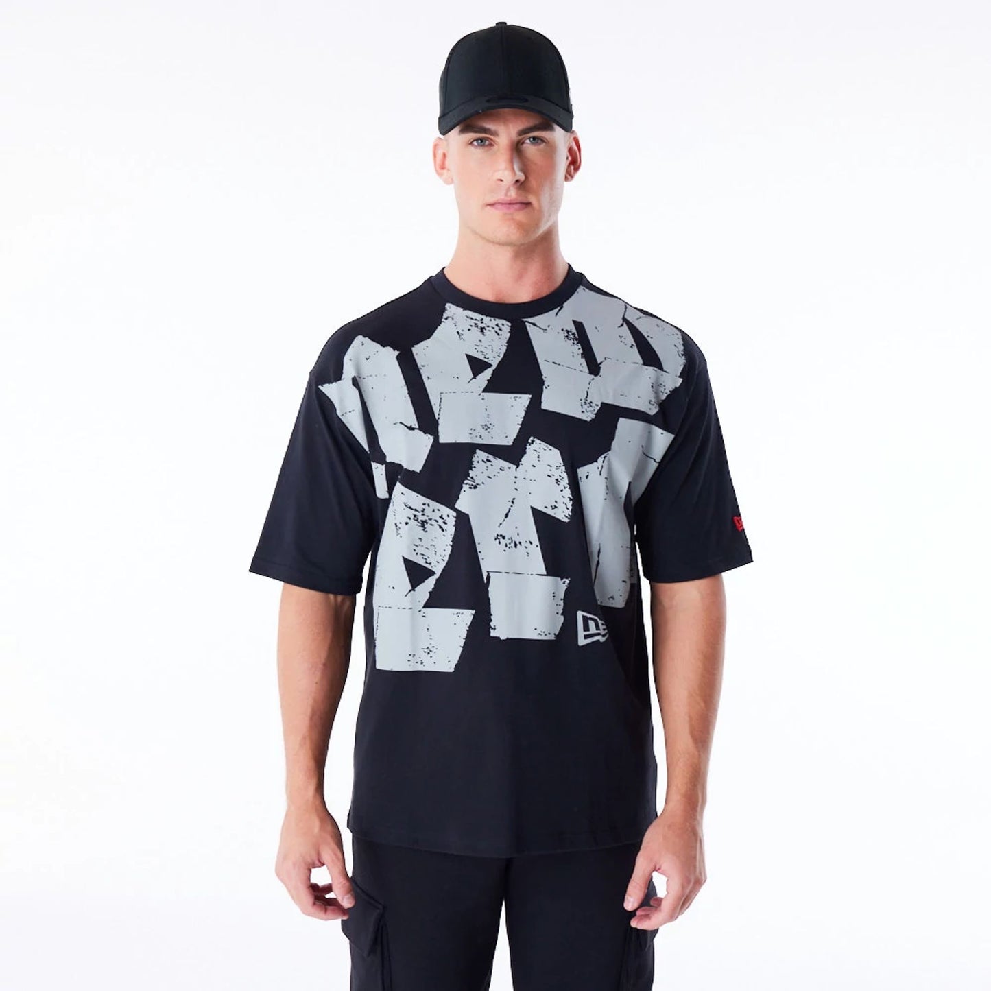 The Male model is wearing New Era Font Graphic Black Oversized T-Shirt 1