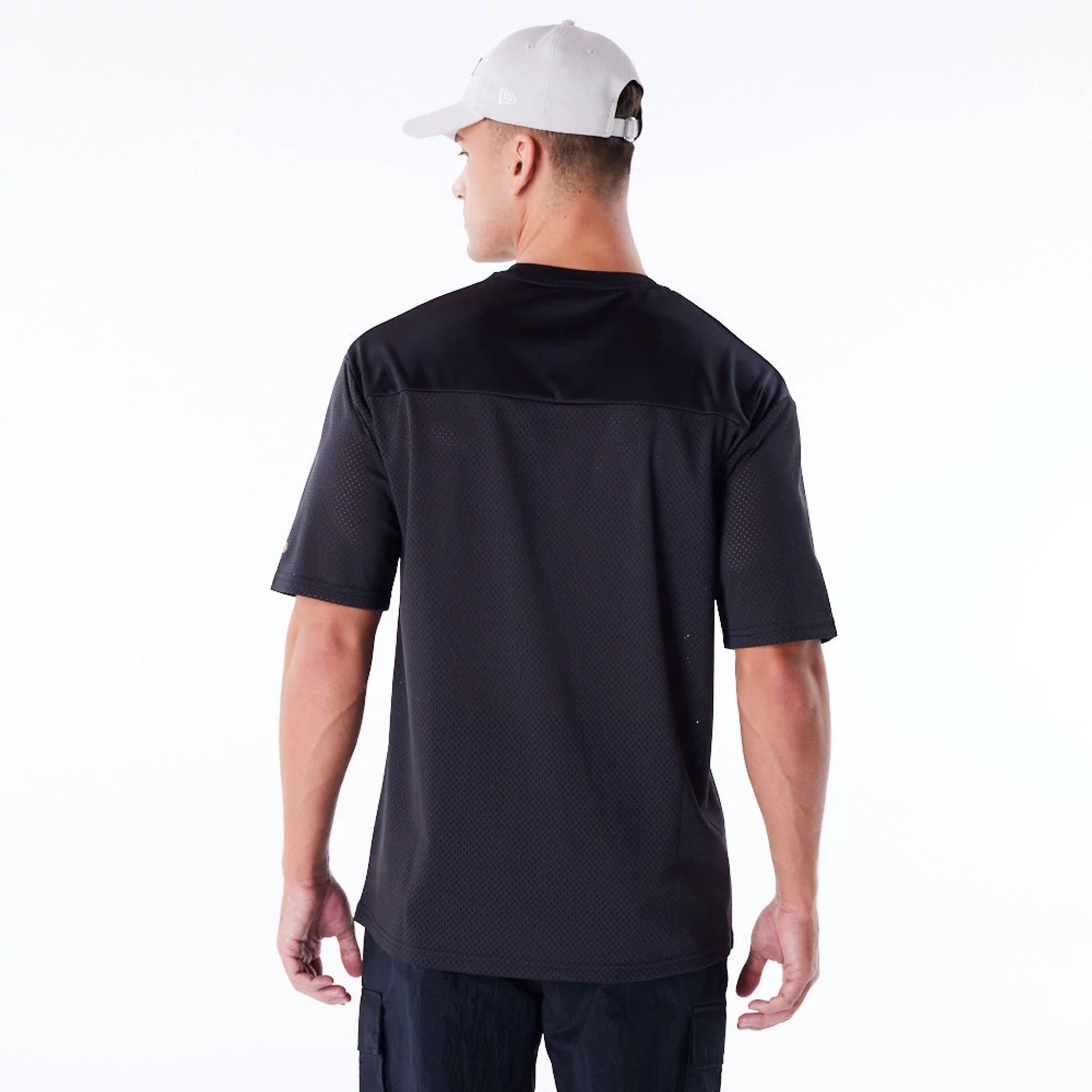 The Male model is wearing New Era Mesh Black Jersey 5