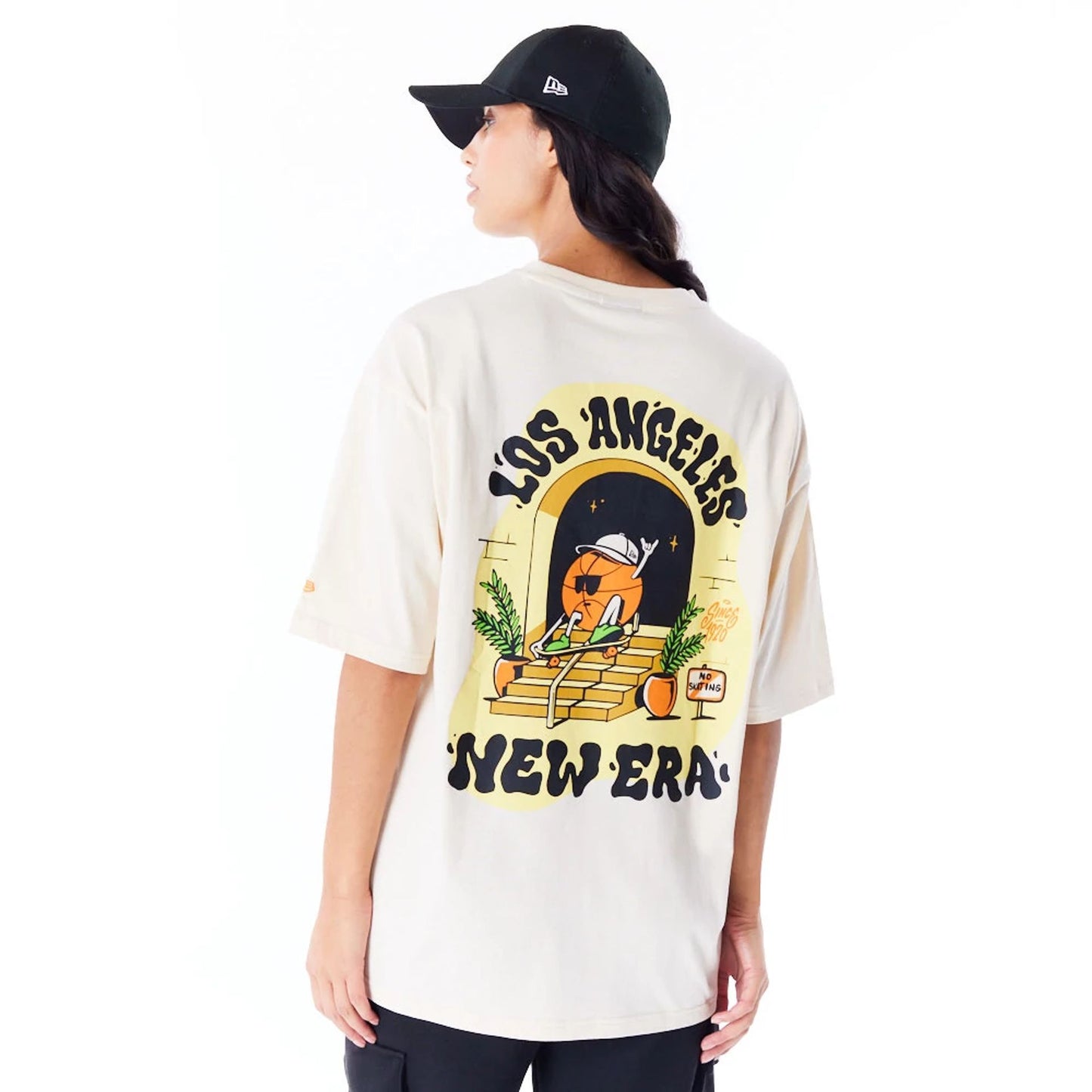 The Male model is wearing New Era Los Angeles City Graphic Stone Oversized T-Shirt 6