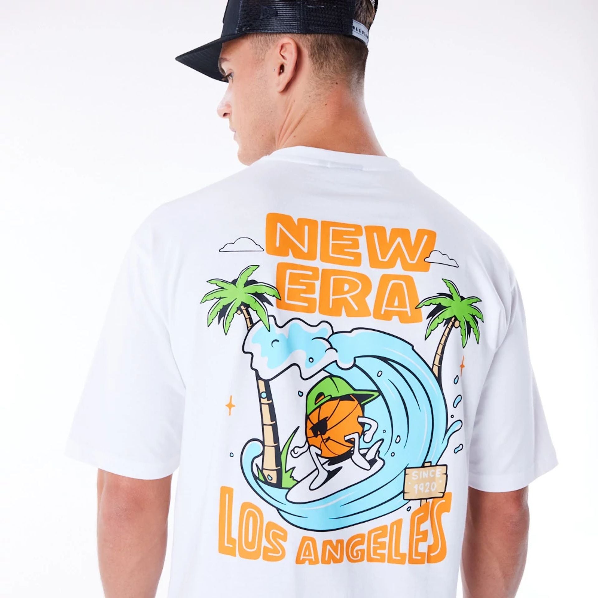 The Male model is wearing New Era Los Angeles City Graphic White Oversized T-Shirt 4