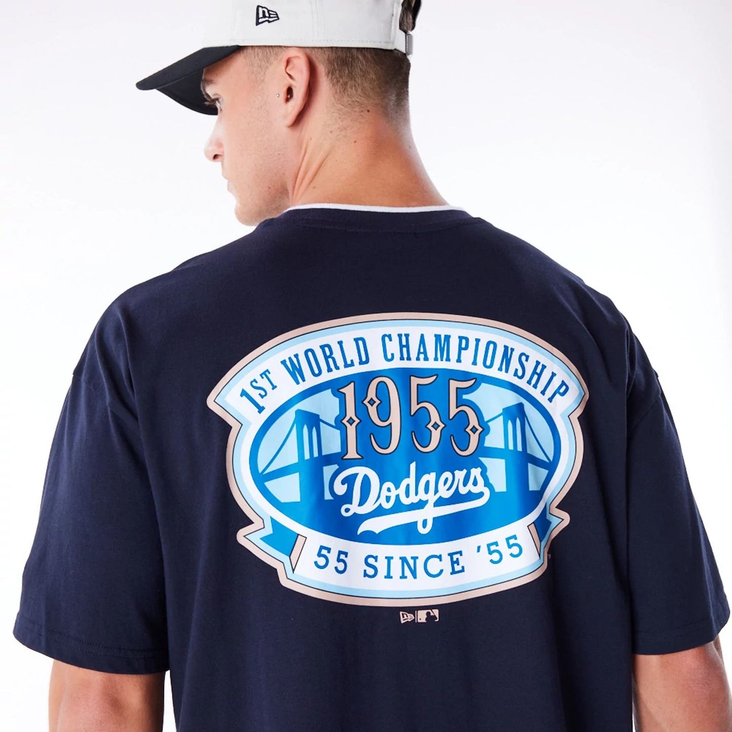 The Male model is wearing LA Dodgers World Series Navy Drop Shoulder T-Shirt  5