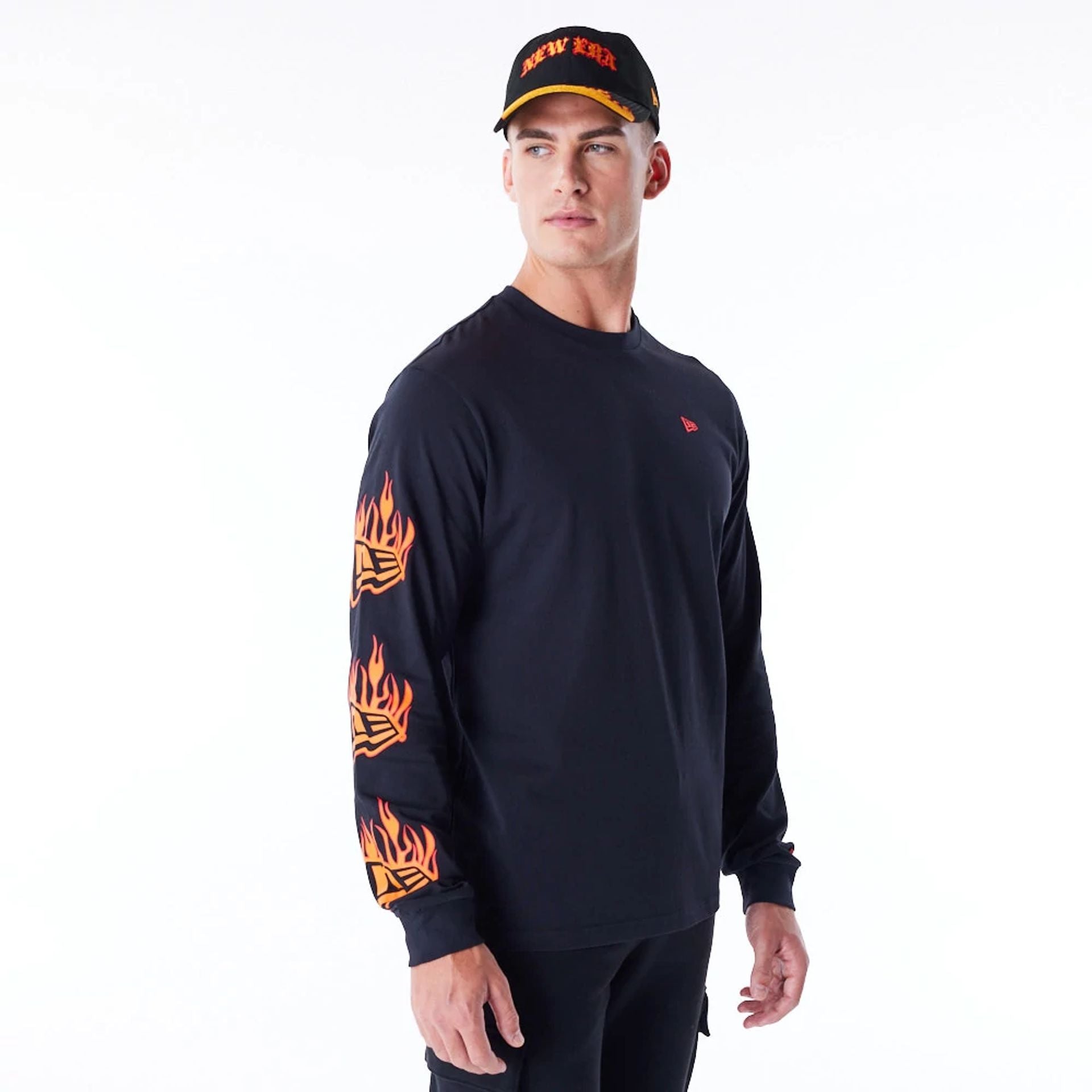 The Male model is wearing New Era Flag Flame Black Long Sleeve T-Shirt 1