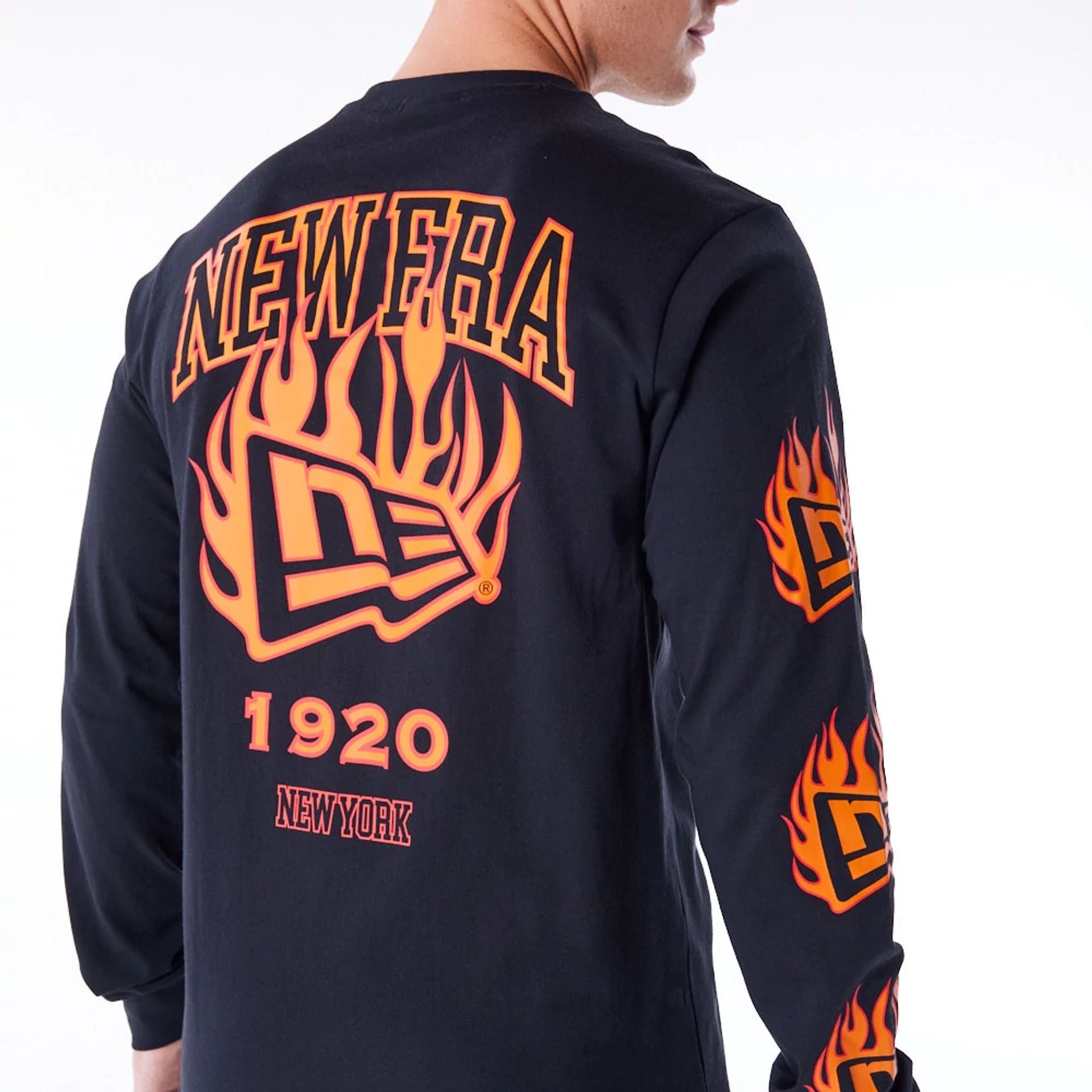 The Male model is wearing New Era Flag Flame Black Long Sleeve T-Shirt 6