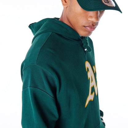 The Male model is wearing Oakland Athletics MLB Rib Infill Dark Green Oversized Pullover Hoodie 5