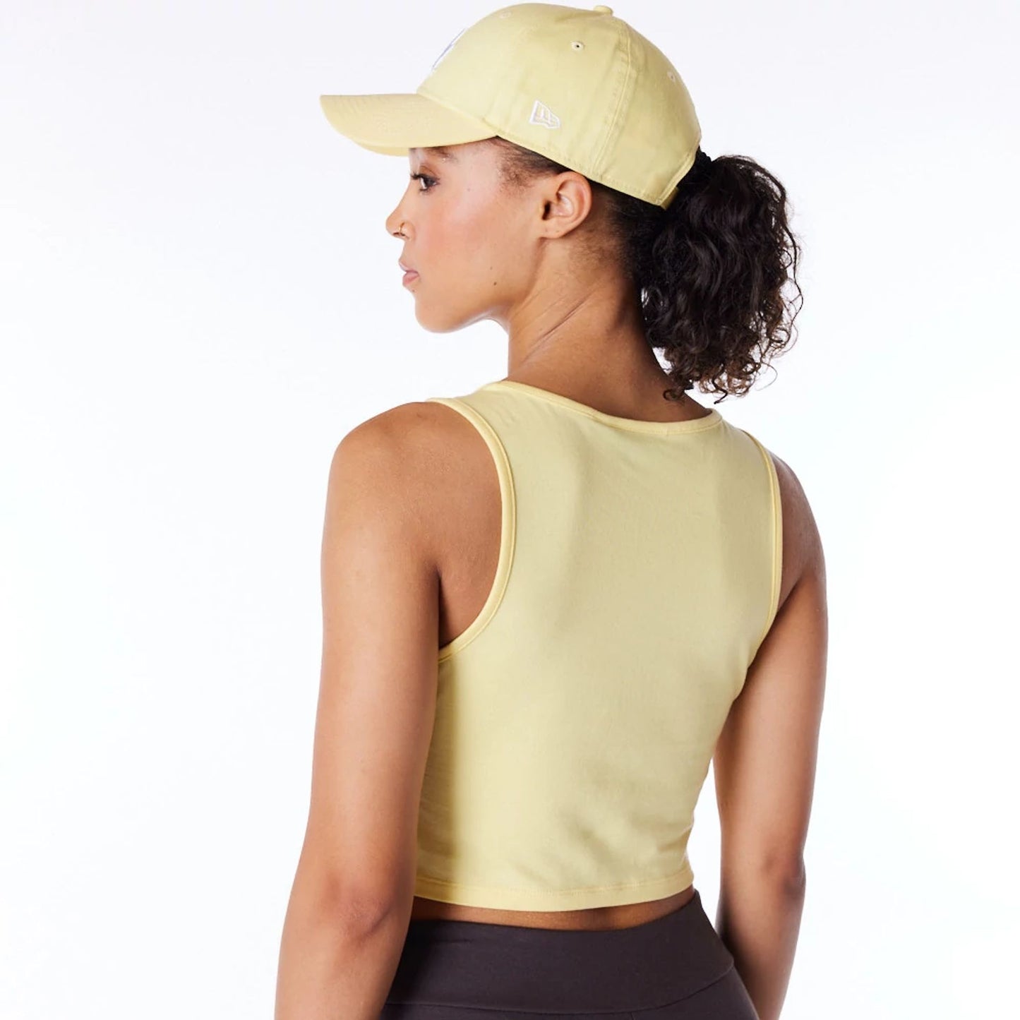 The Female model is wearing LA Dodgers Womens MLB League Essential Pastel Yellow Crop Tank Top 3