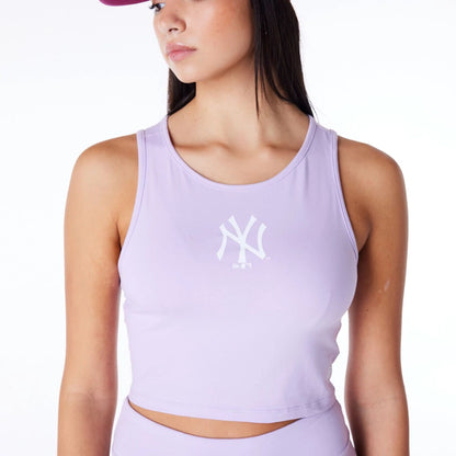 The Female model is wearing New York Yankees Womens MLB League Essential Pastel Purple Crop Tank Top 7