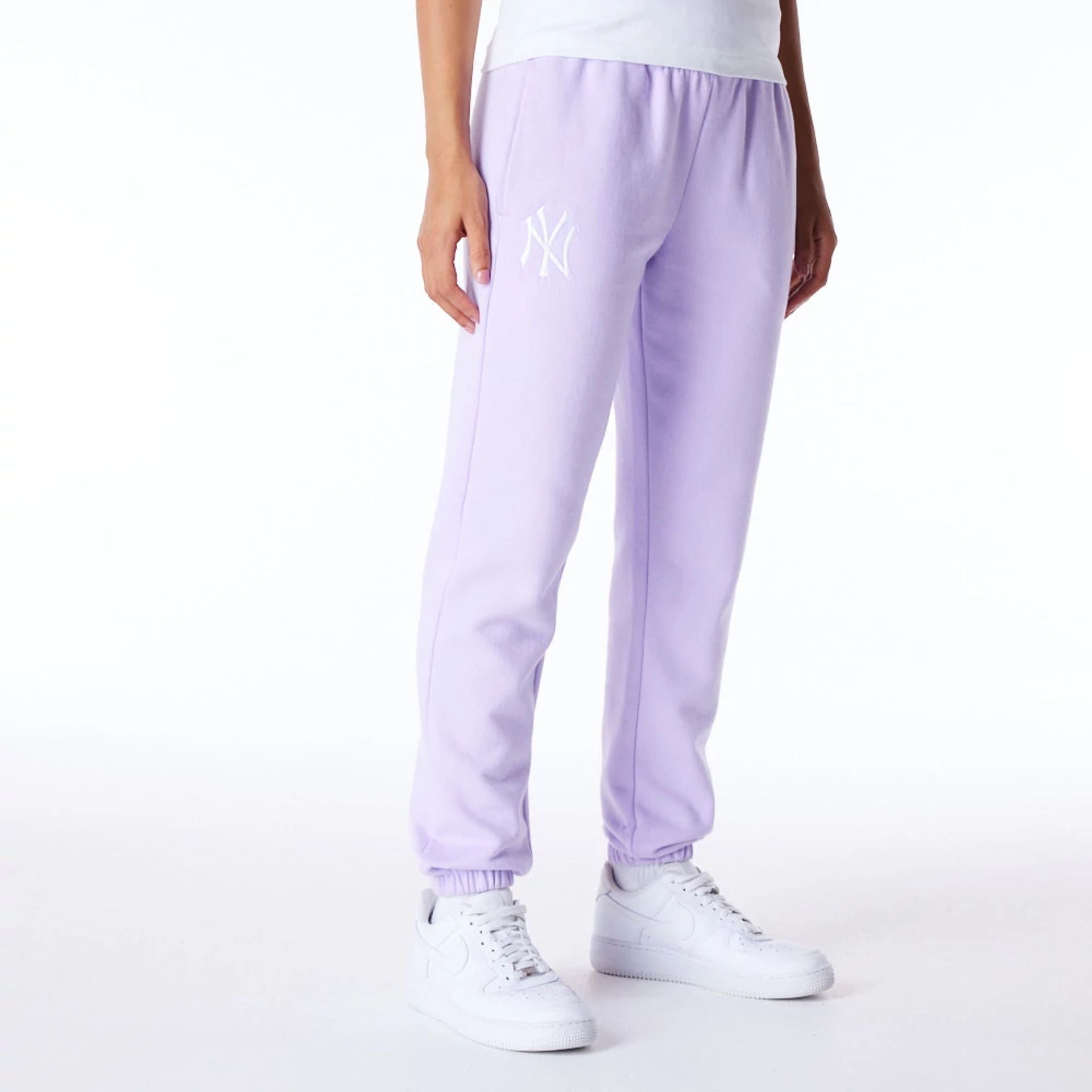 The Female model is wearing New York Yankees Womens MLB League Essential Pastel Purple Fleece Joggers 1