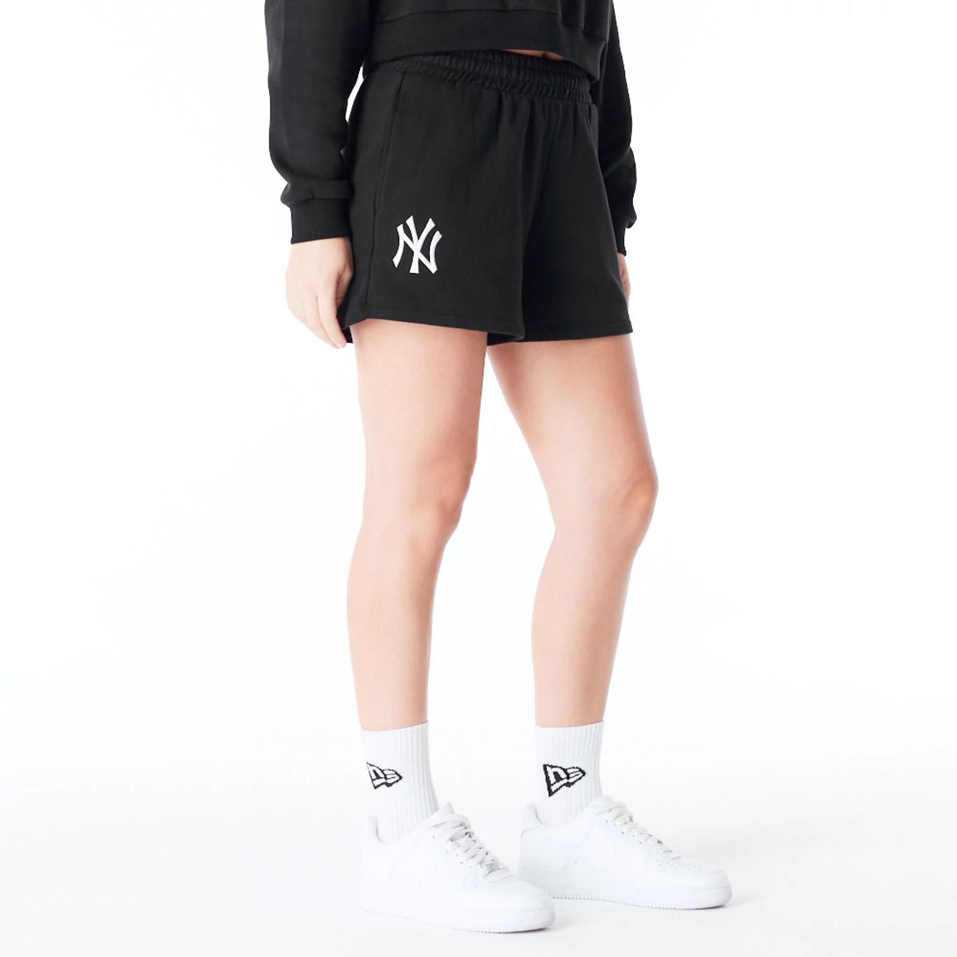 The Female model is wearing New York Yankees Womens MLB League Essential Black Shorts 6