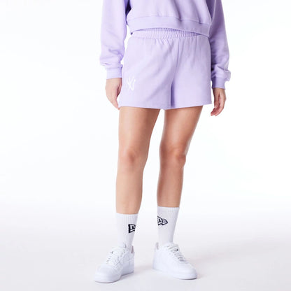 The Female model is wearing New York Yankees Womens MLB League Essential Pastel Purple Shorts 8