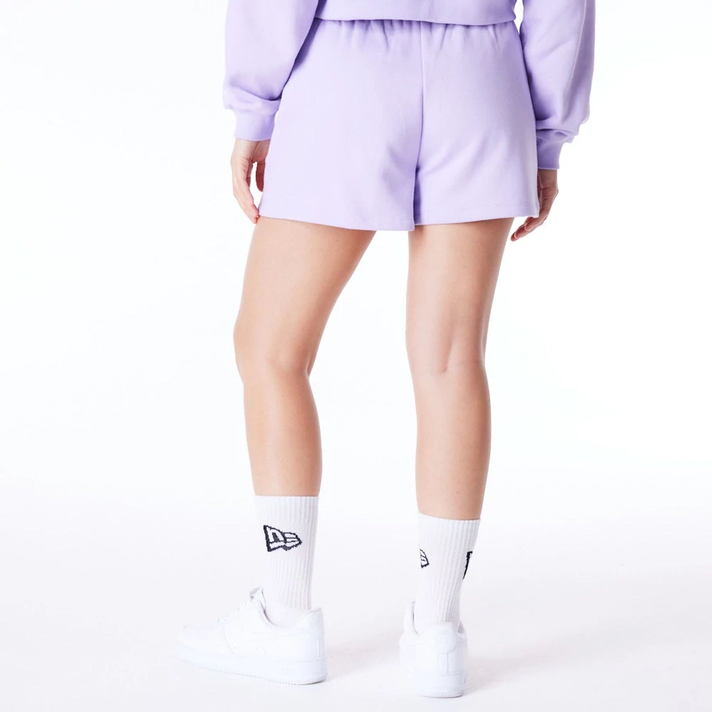 The Female model is wearing New York Yankees Womens MLB League Essential Pastel Purple Shorts 4